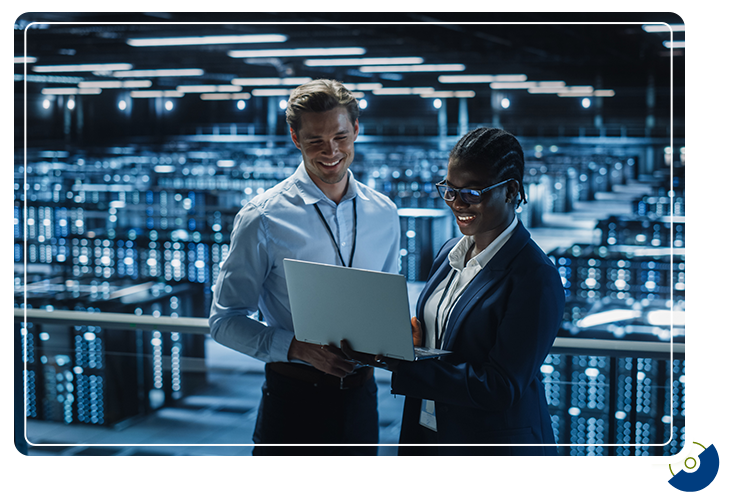 two smiling engineers go over a plan